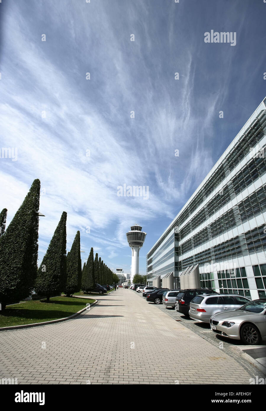 Illustration Airport: Munich Airport exterior view with tower, trees and office buildings Stock Photo