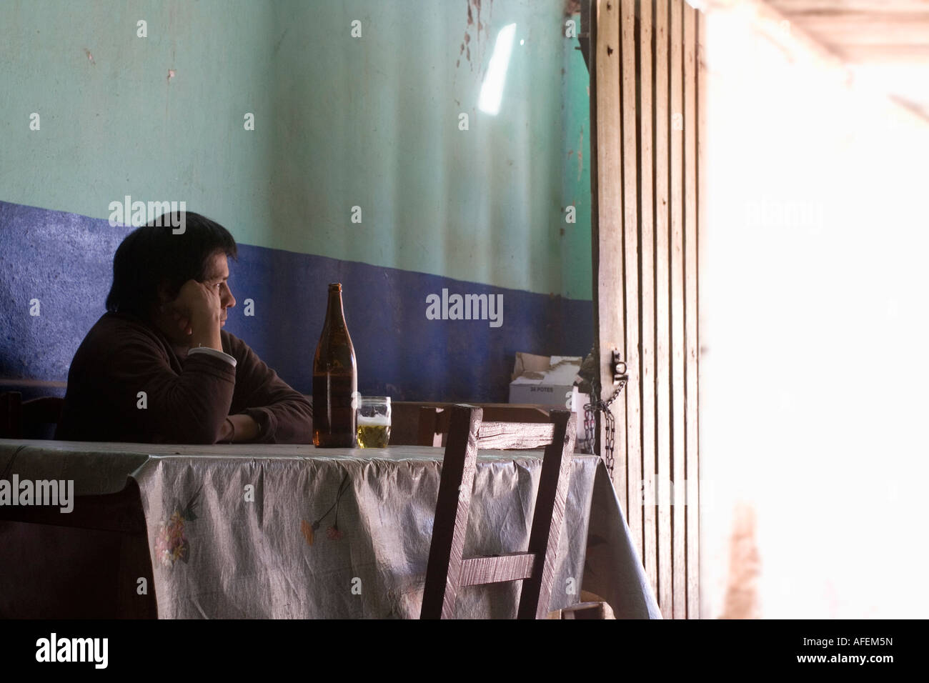 workerman looking outside in a humble dining in Jujuy, Argentina Stock Photo