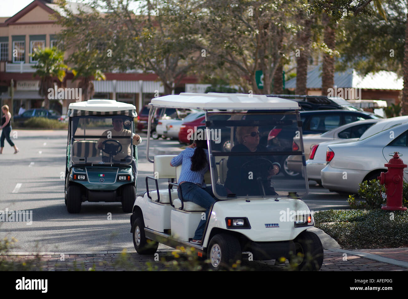 People driving golf carts in Florida Stock Photo Alamy