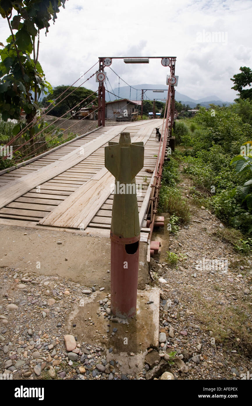 Bridge over the river Nam Song with bomb casings as bollards, on the way to the Tham Phu Kham (Poukham) cave, Vang Vieng, Laos Stock Photo