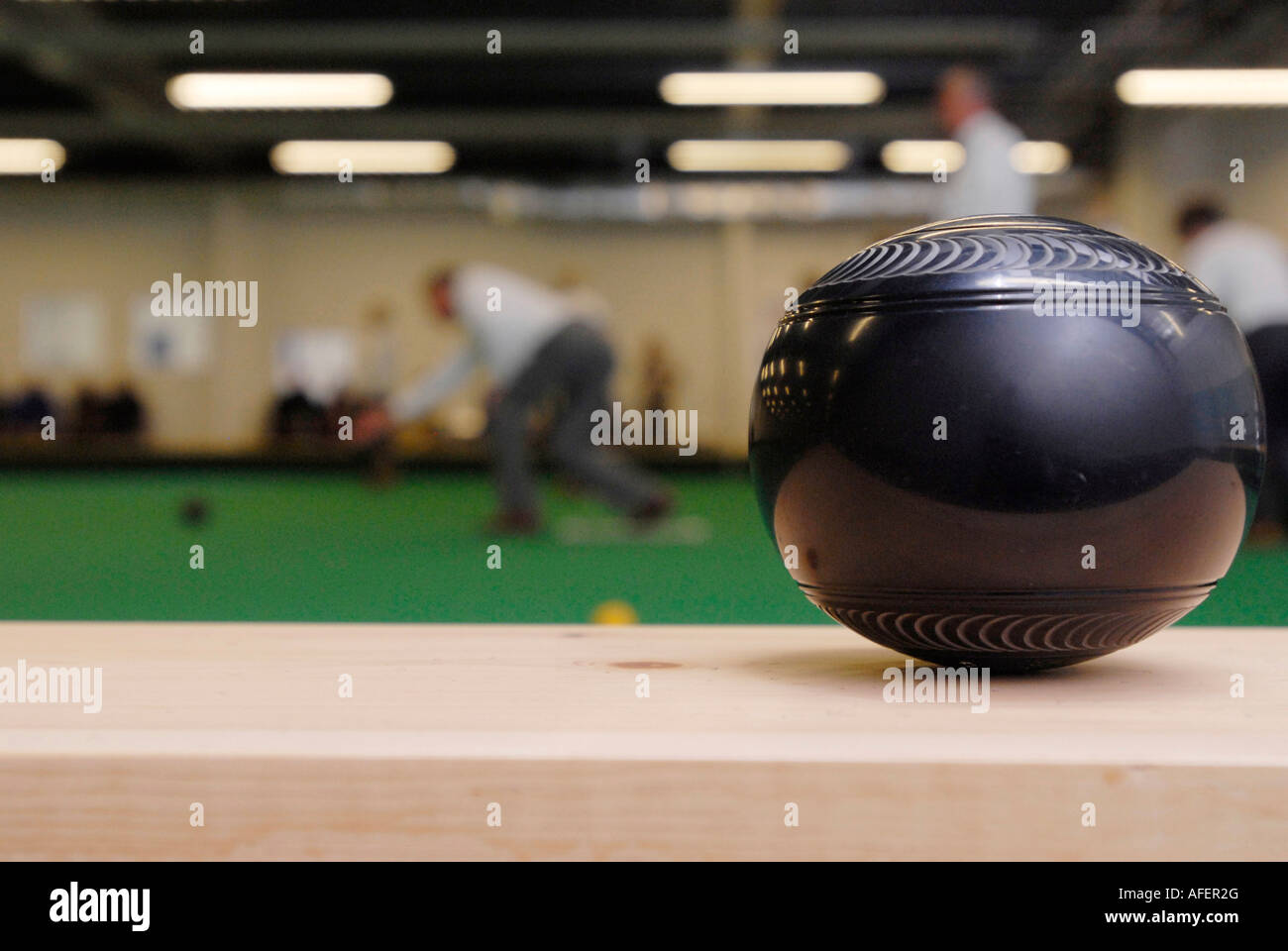 Bowling ball at an indoor bowls green Stock Photo