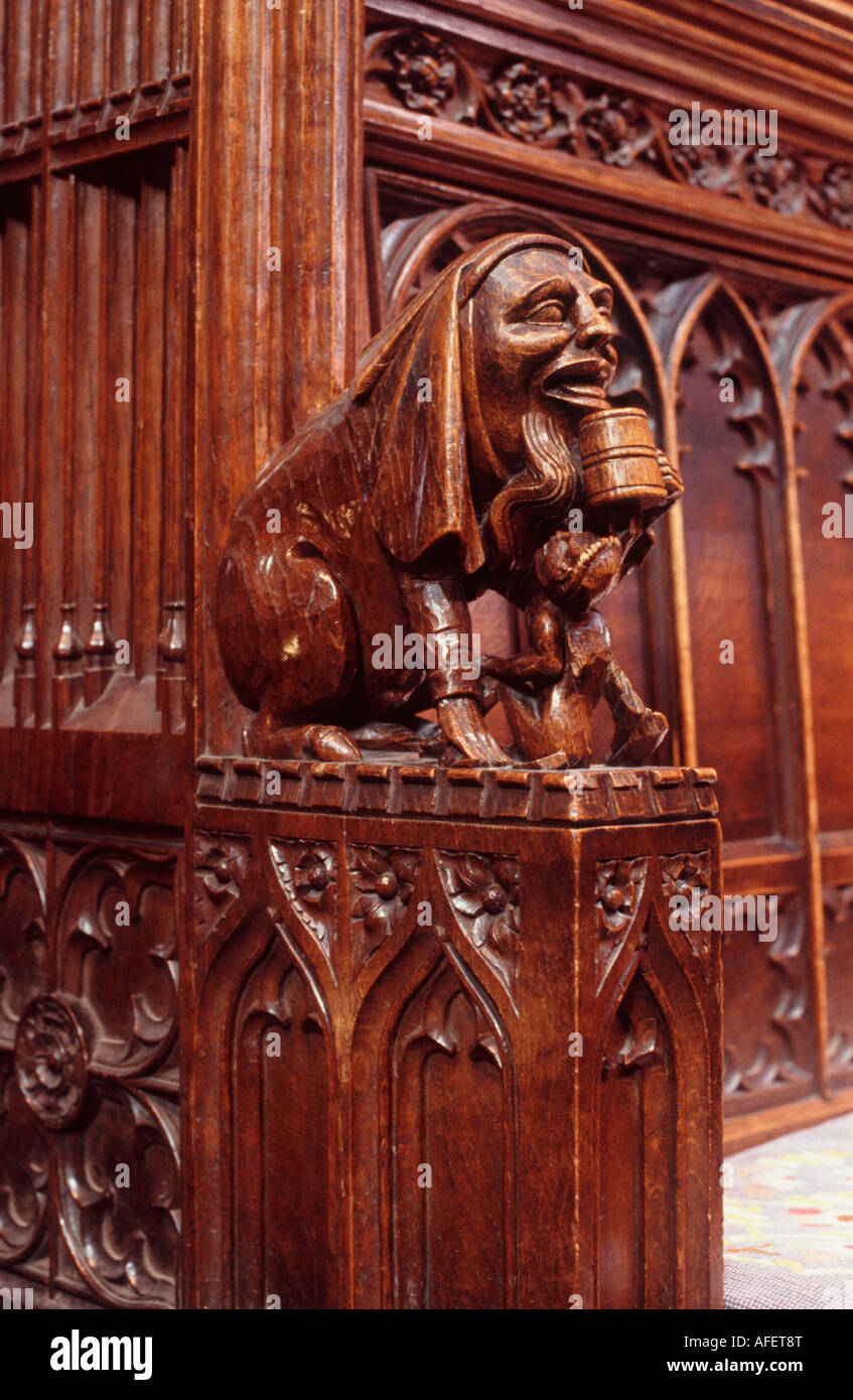 Carved wooden figure (circa 1390) drinking from an ale tankard, choir stall, Chester Cathedral, Cheshire, England Stock Photo