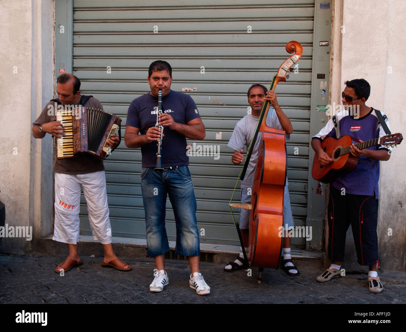 quartet of street buskers in Rome Stock Photo - Alamy