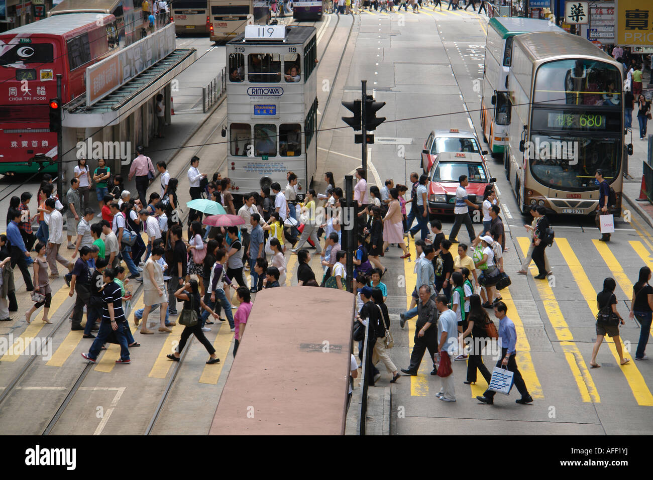 Pedestrians crossing zebra cross in Central district Hong Kong China Stock Photo