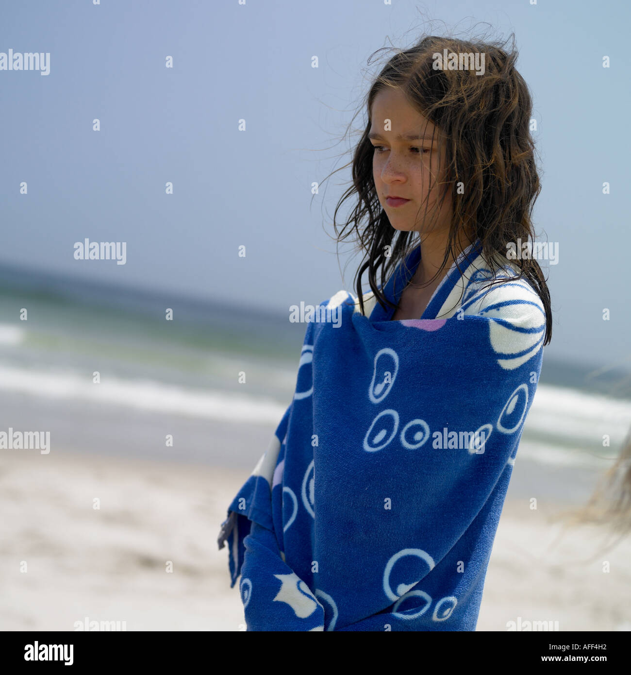 portrait of a young girl in wrapped in a blue towel Stock Photo - Alamy