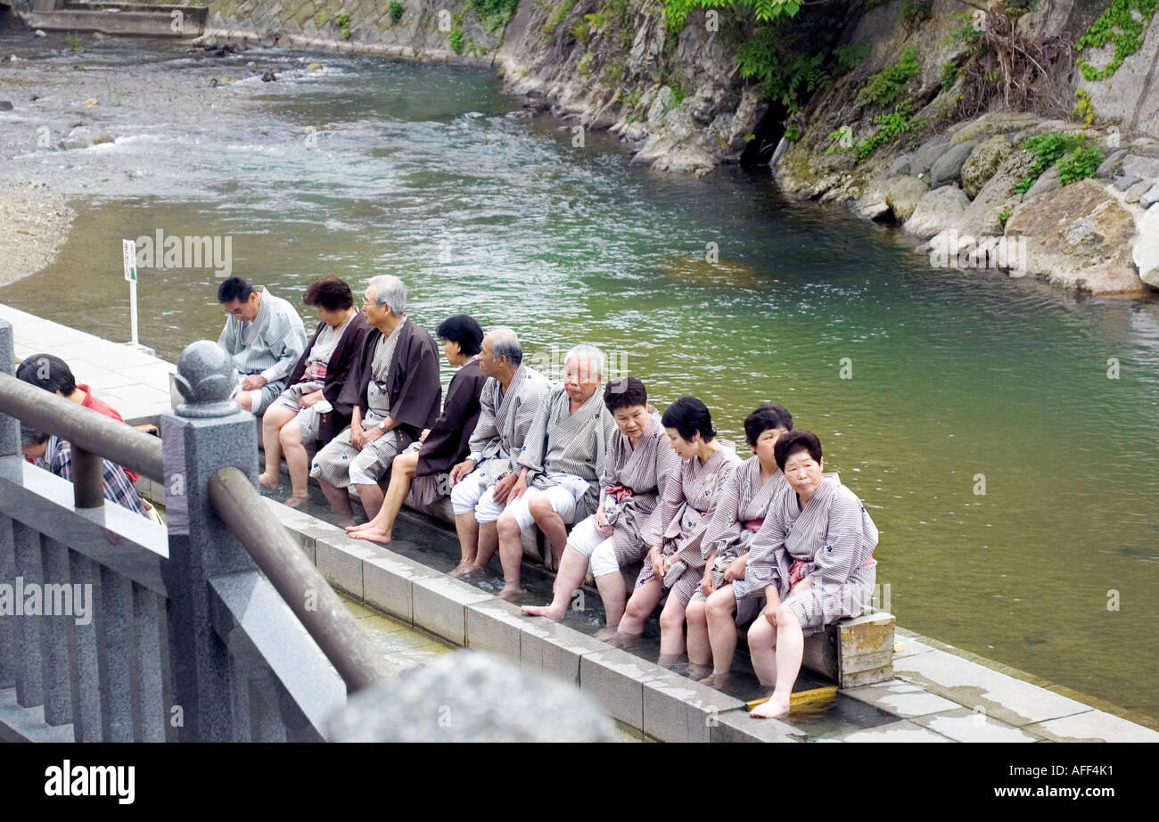 senior japanese people doing foot bath, arima onsen, hyogo, japan Stock