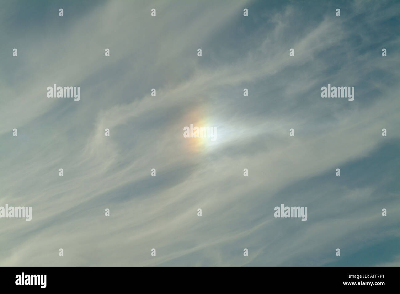 Sundog seen through high cirrus cloud Stock Photo