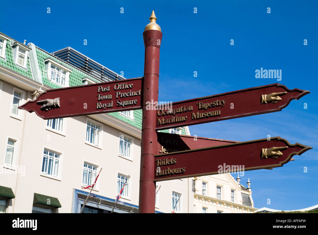 dh ST HELIER JERSEY Tourist signpost showing directions to attractions  information sign signs channel islands Stock Photo - Alamy