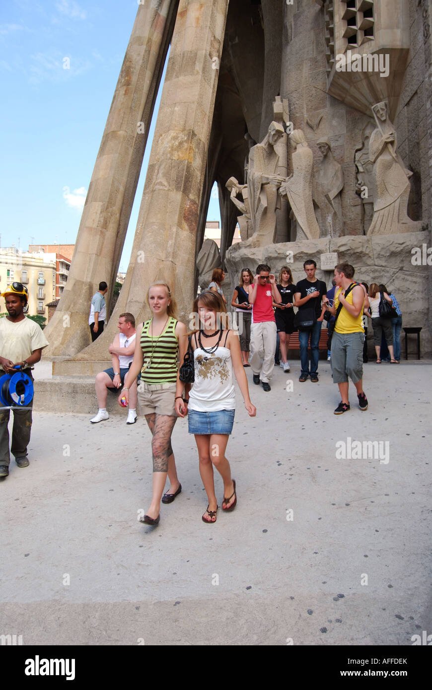 tourists at west wing of Sagrada Familia Passion Facade Carrer de Sardenya Barcelona Spain Stock Photo