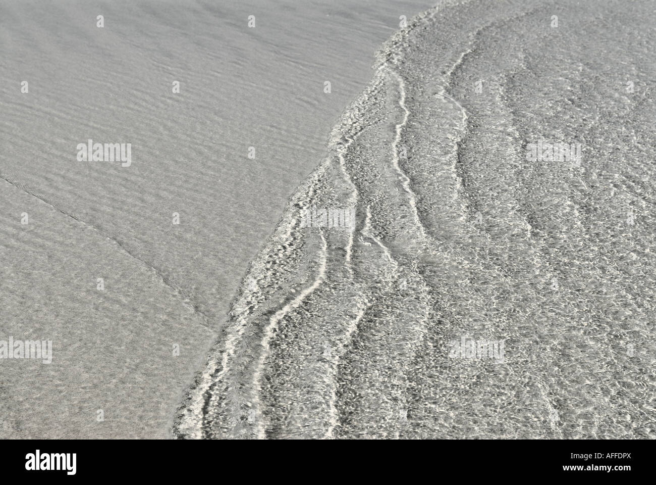 waves sweeping over sandy beach, Dubai, United Arab Emirates Stock ...