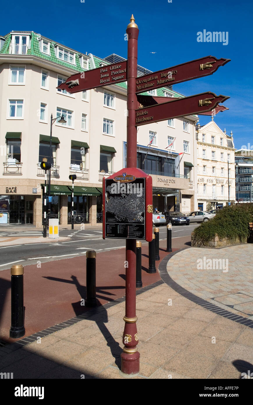 dh Tourist information signpost ST HELIER JERSEY And town map showing directions to attractions sign post arrow Stock Photo