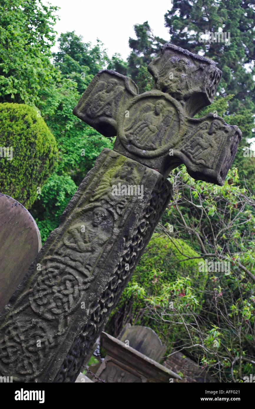 The Celtic Cross in the grounds of Eyam Parish Church Stock Photo