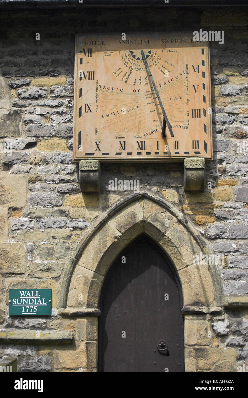 The wall sundial at Saint Lawrence's Church. Eyam, Derbyshire, United Kingdom. Stock Photo