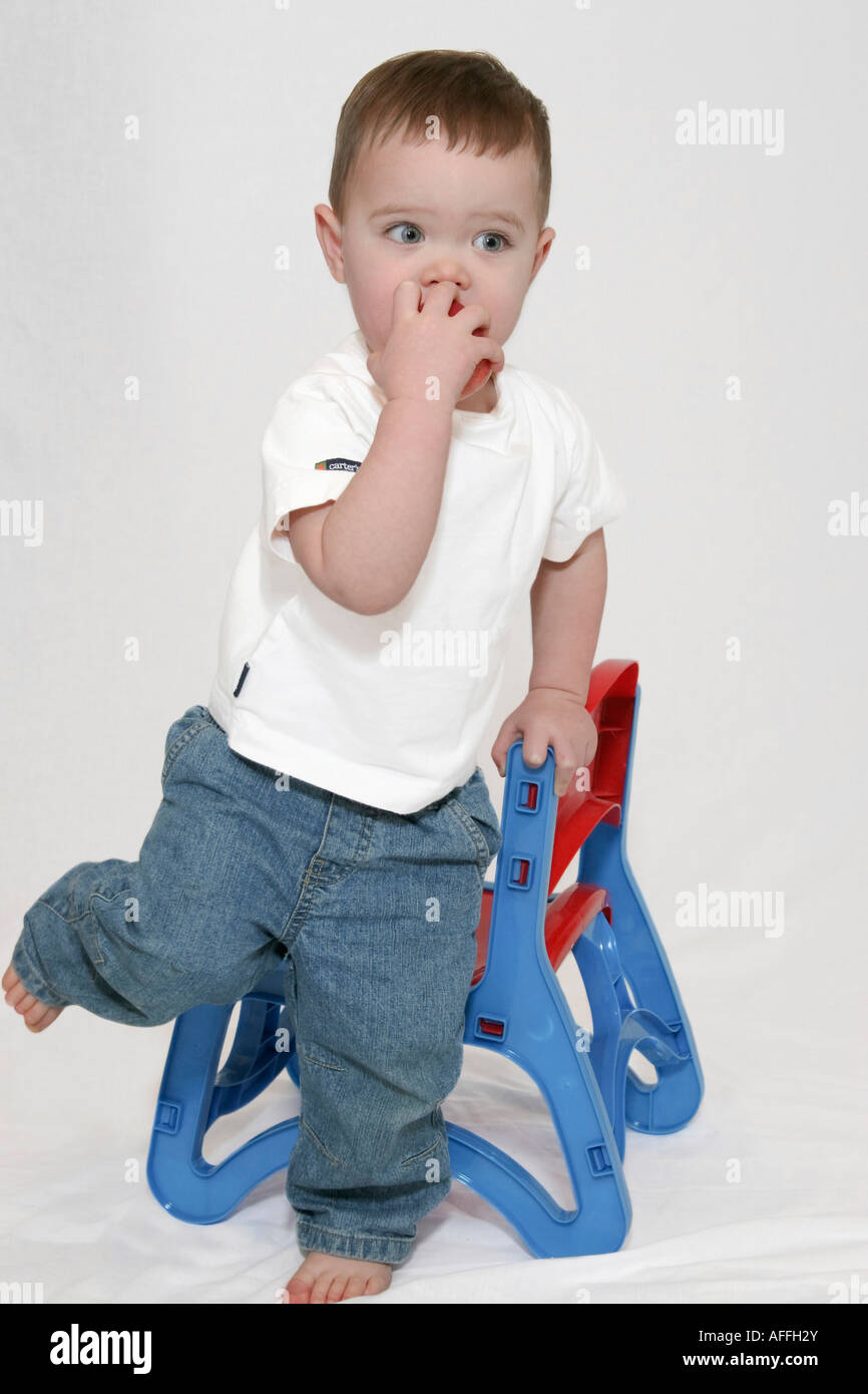 Portrait of toddler boy on white background pictures images photos photograph photography very high resolution vertical format in USA US hi-res Stock Photo
