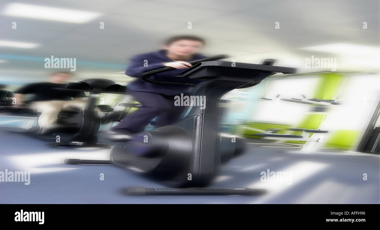 person working out on step machine at the gym Stock Photo Alamy