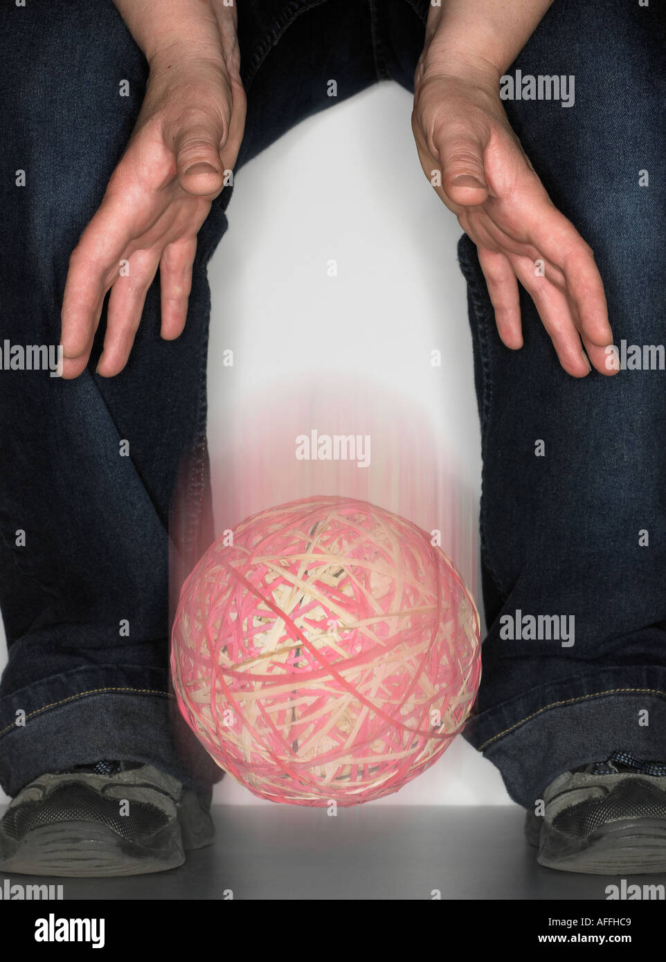 dropping a rubber band ball Stock Photo