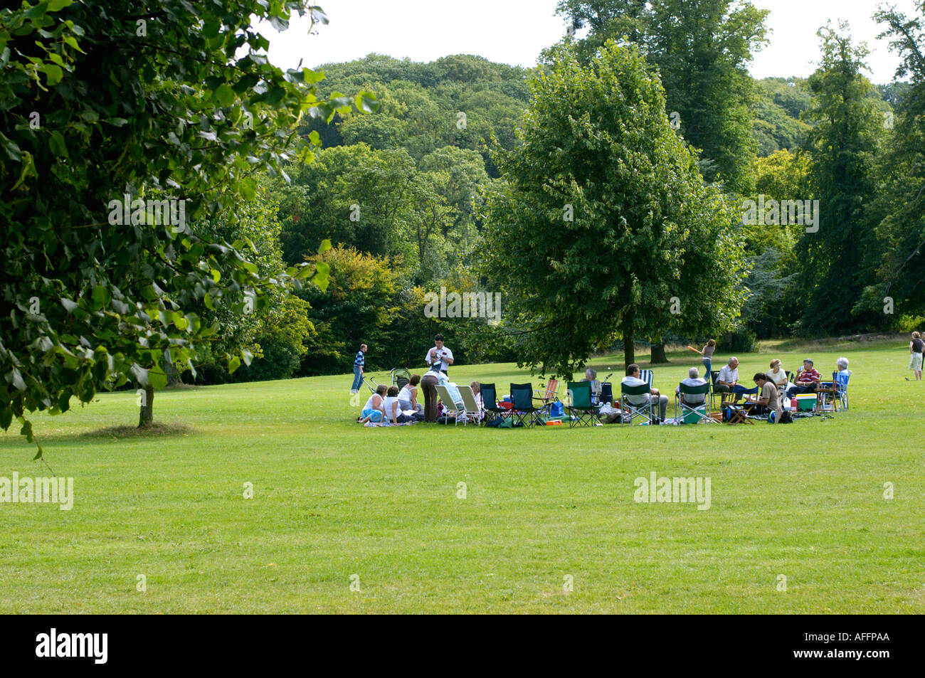Group of people on lawn Blaise Castle Estate Bristol England Stock Photo