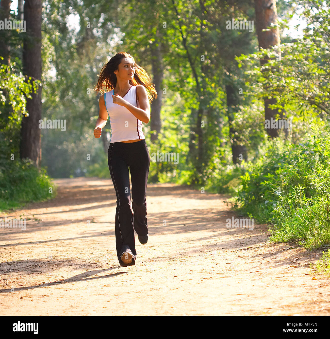 Young woman runnning Stock Photo