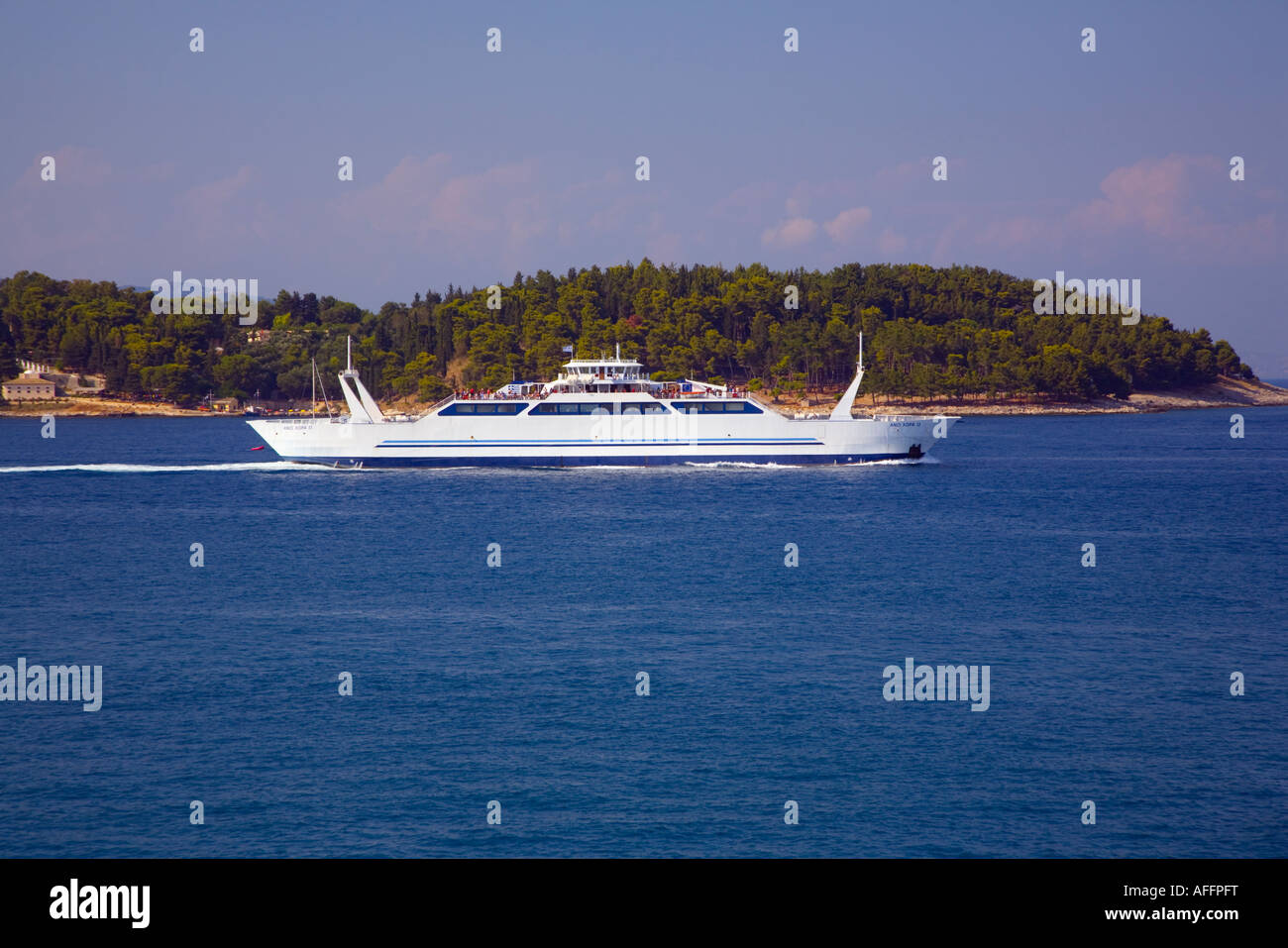 Double ended car ferry Ano Hora 2 leaving Corfu harbour with Vidos island behind Stock Photo