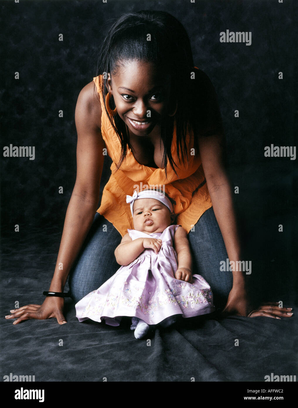 Coloured Mother and Her Baby Stock Photo