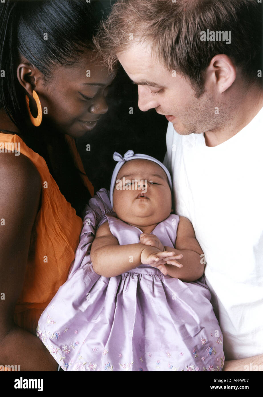 Mixed Race Family Group Caucasian Father African Mother and Baby Stock Photo