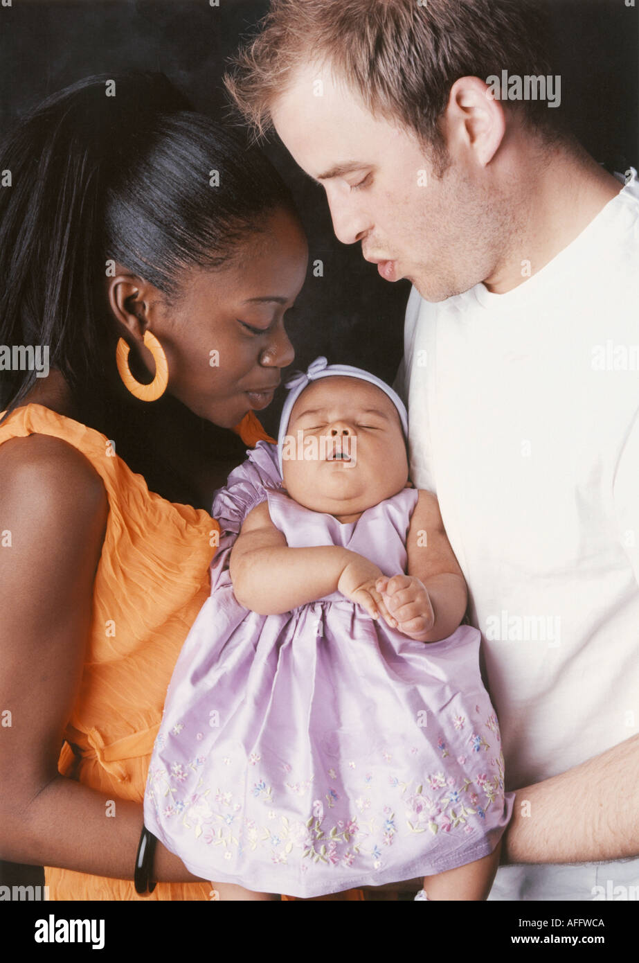 Mixed Race Family Group Caucasian Father African Mother and Baby Stock Photo