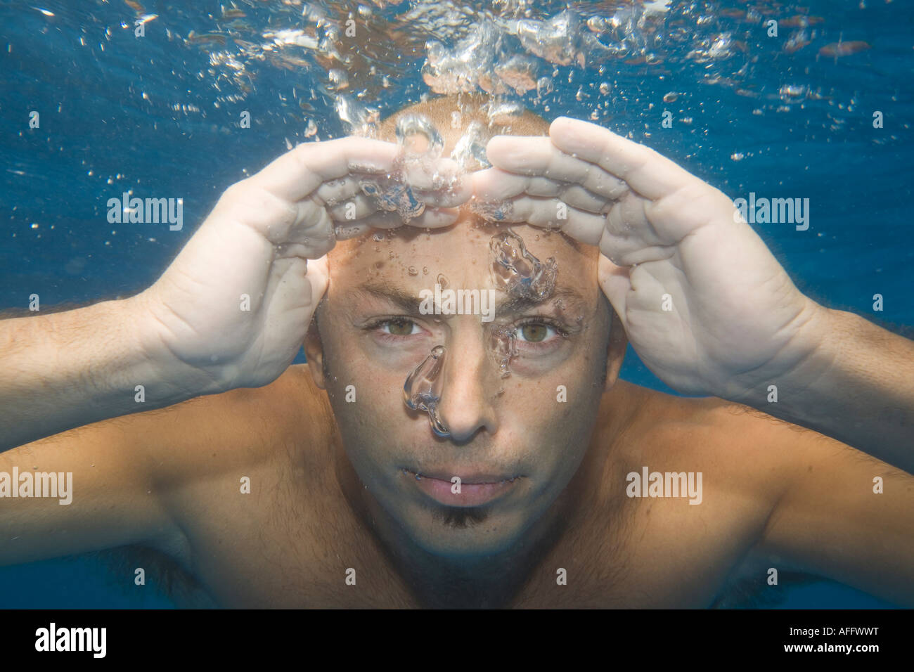 Man under water looking for something Stock Photo Alamy