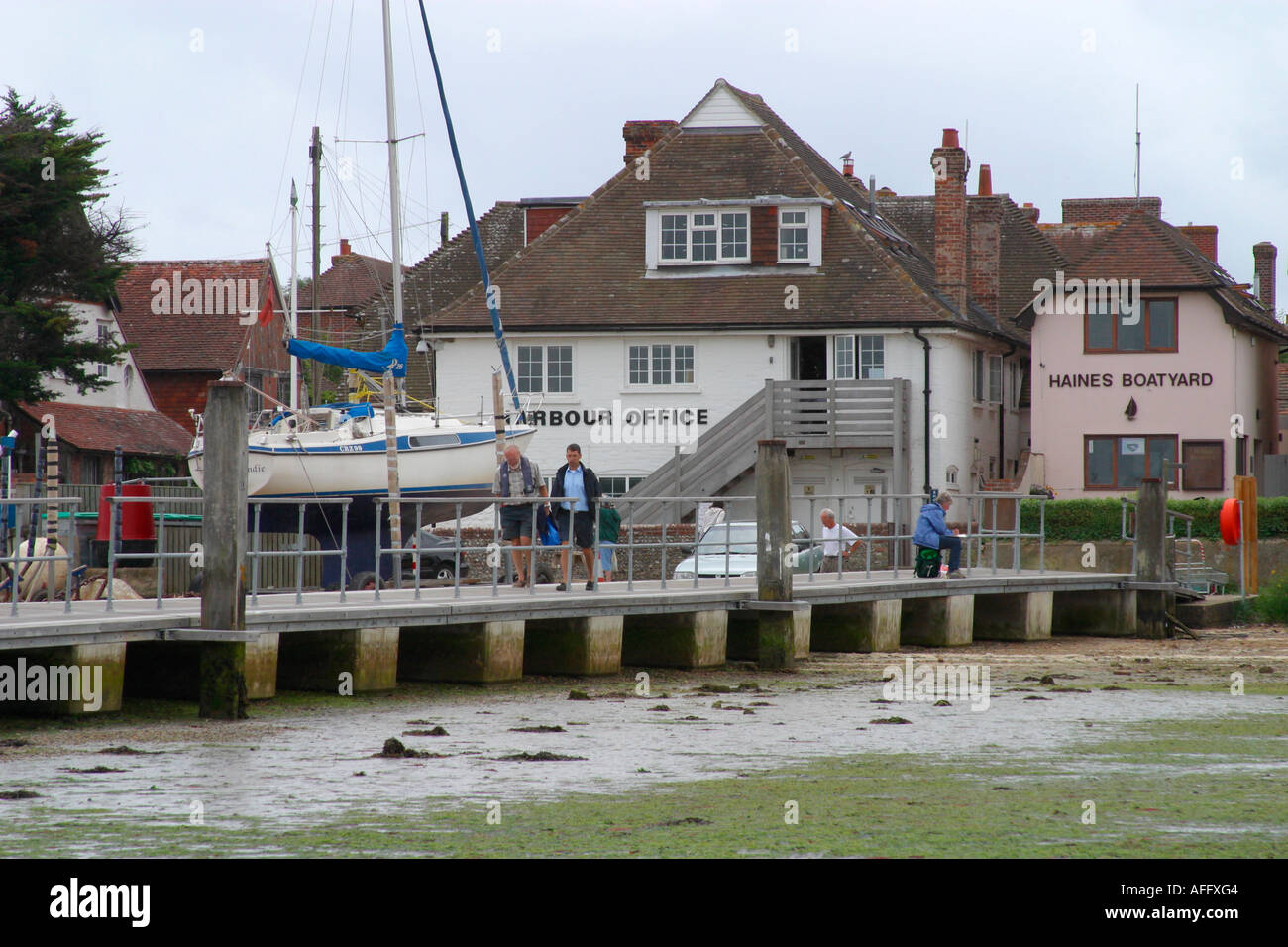 Harbour Master's Office and wooden jetty at Itchenor Harbour, West Sussex Stock Photo