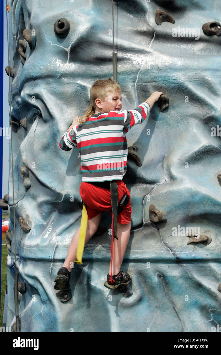 Little boy having fun on the climbing wall at RAFA Charity Airshow at ...