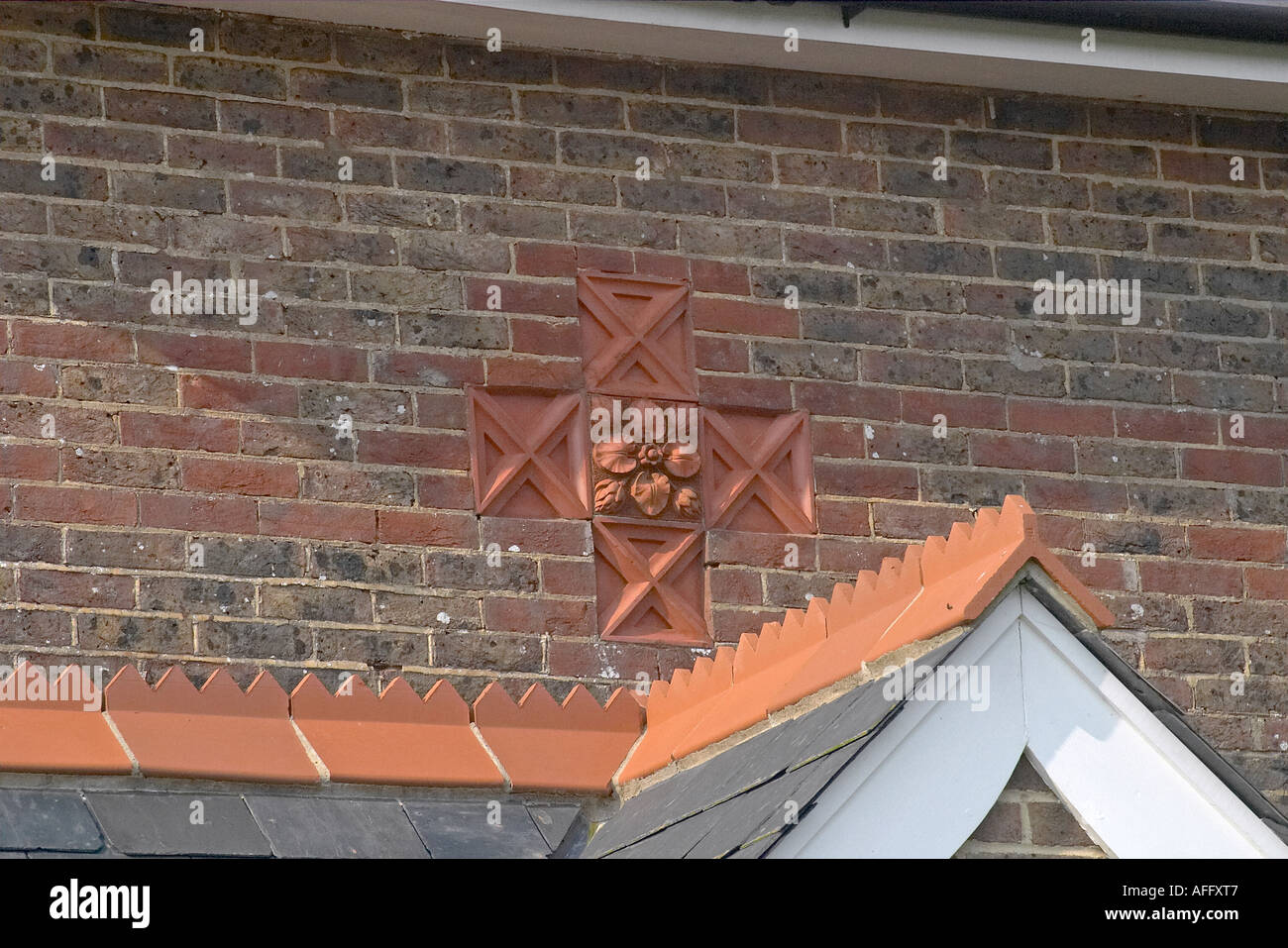 Decorative tiles set into front elevation of a house in Henfield, Sussex Stock Photo