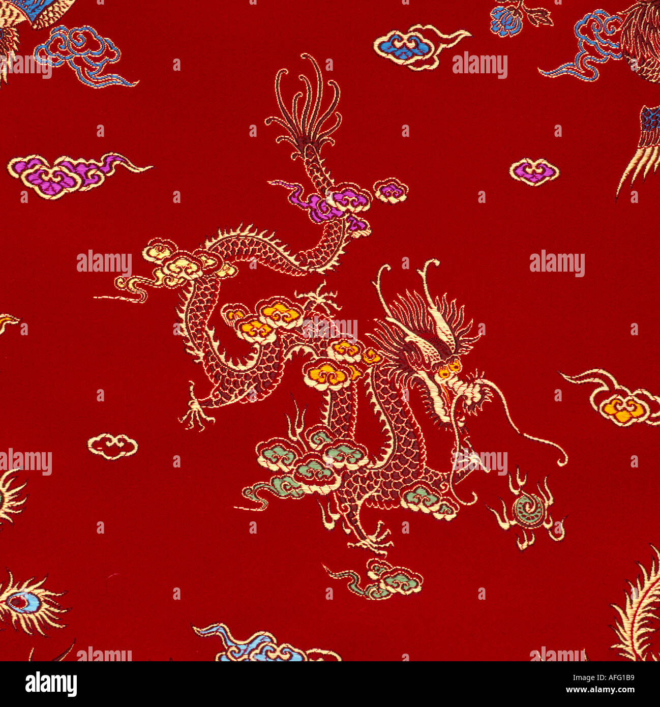 Red silk material textile with gold embroidered dragon Stock Photo - Alamy