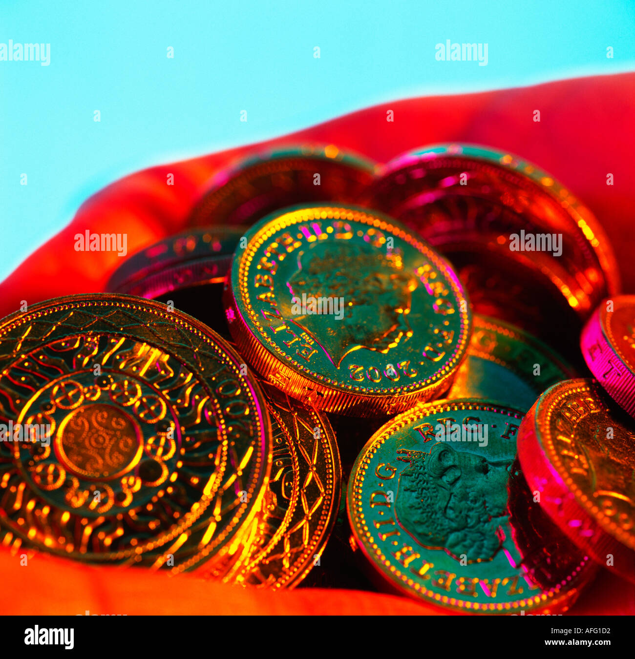 Sterling pound coins in hand Stock Photo Alamy