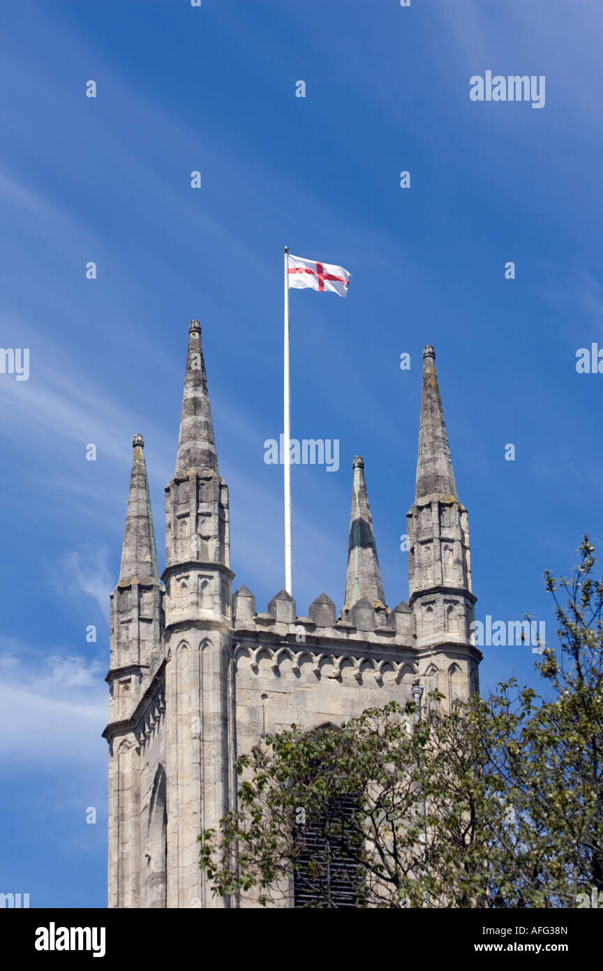 Flag of St George flying above tower of St John s parish church Windsor High Street Berkshire England Stock Photo