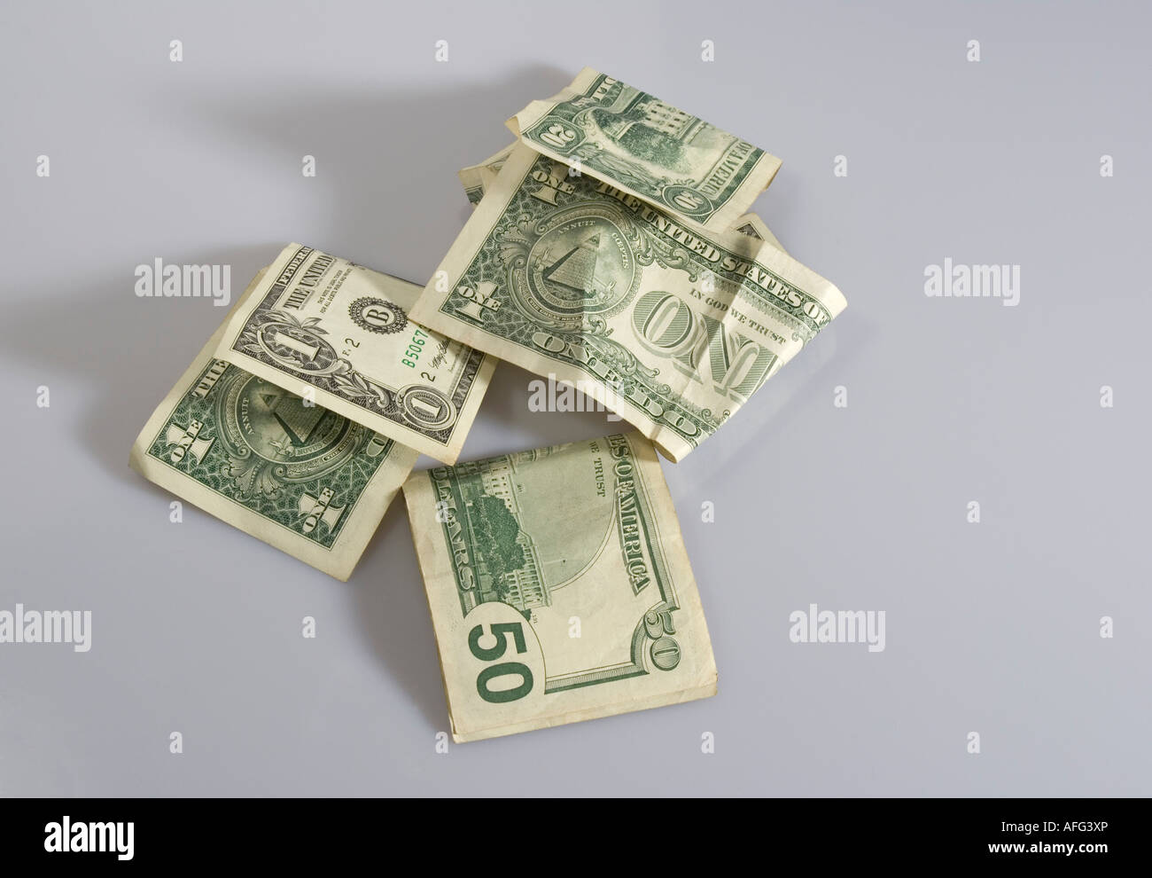 Crumpled up dollar bills hi-res stock photography and images - Alamy