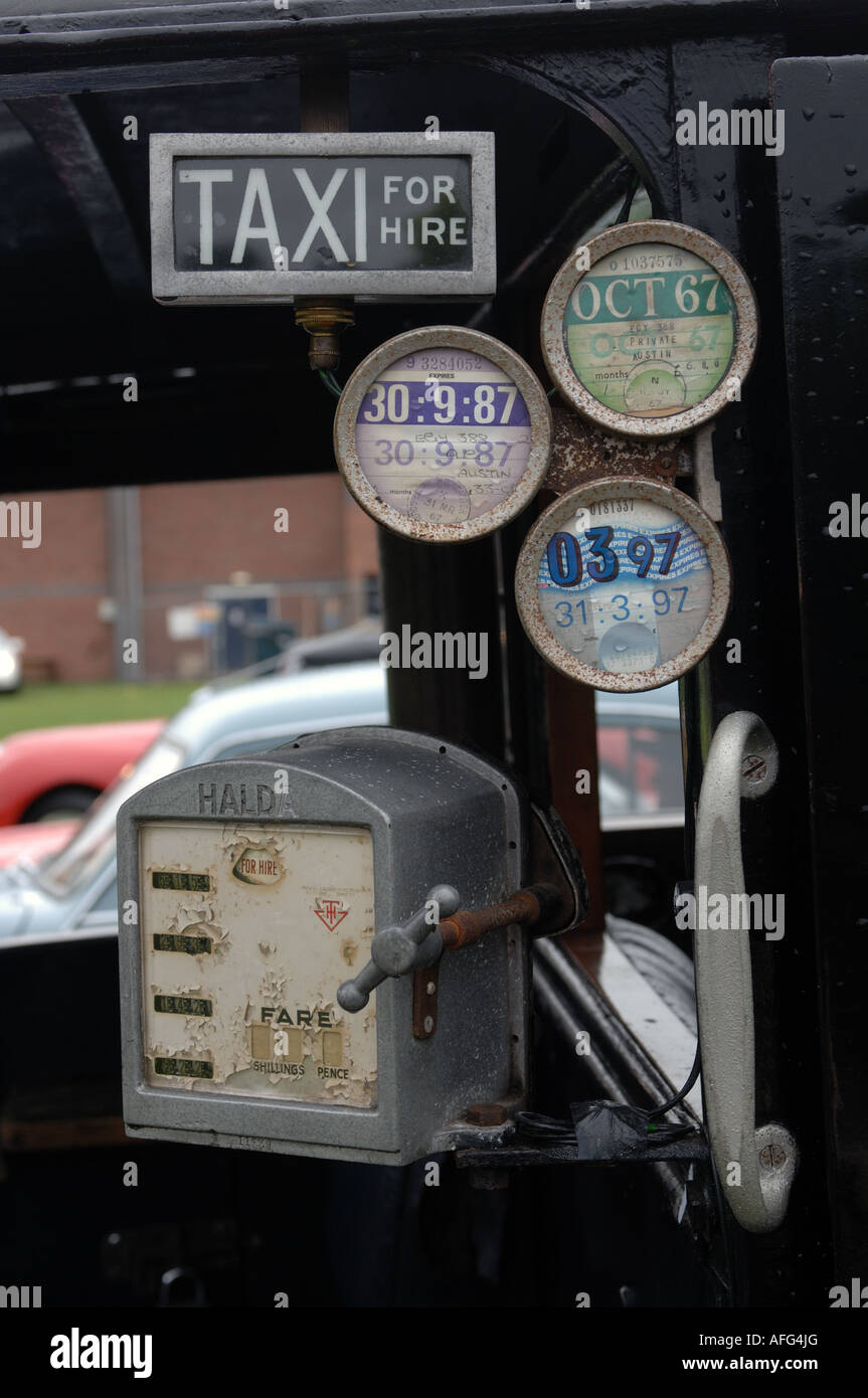 Close up of Halda fare meter on a classic car Austin 10 Taxi Stock