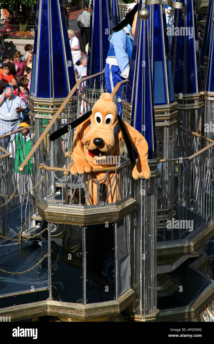 Disney characters on a Magic Kingdom afternoon parade at Orlando Florida Pluto dog Stock Photo