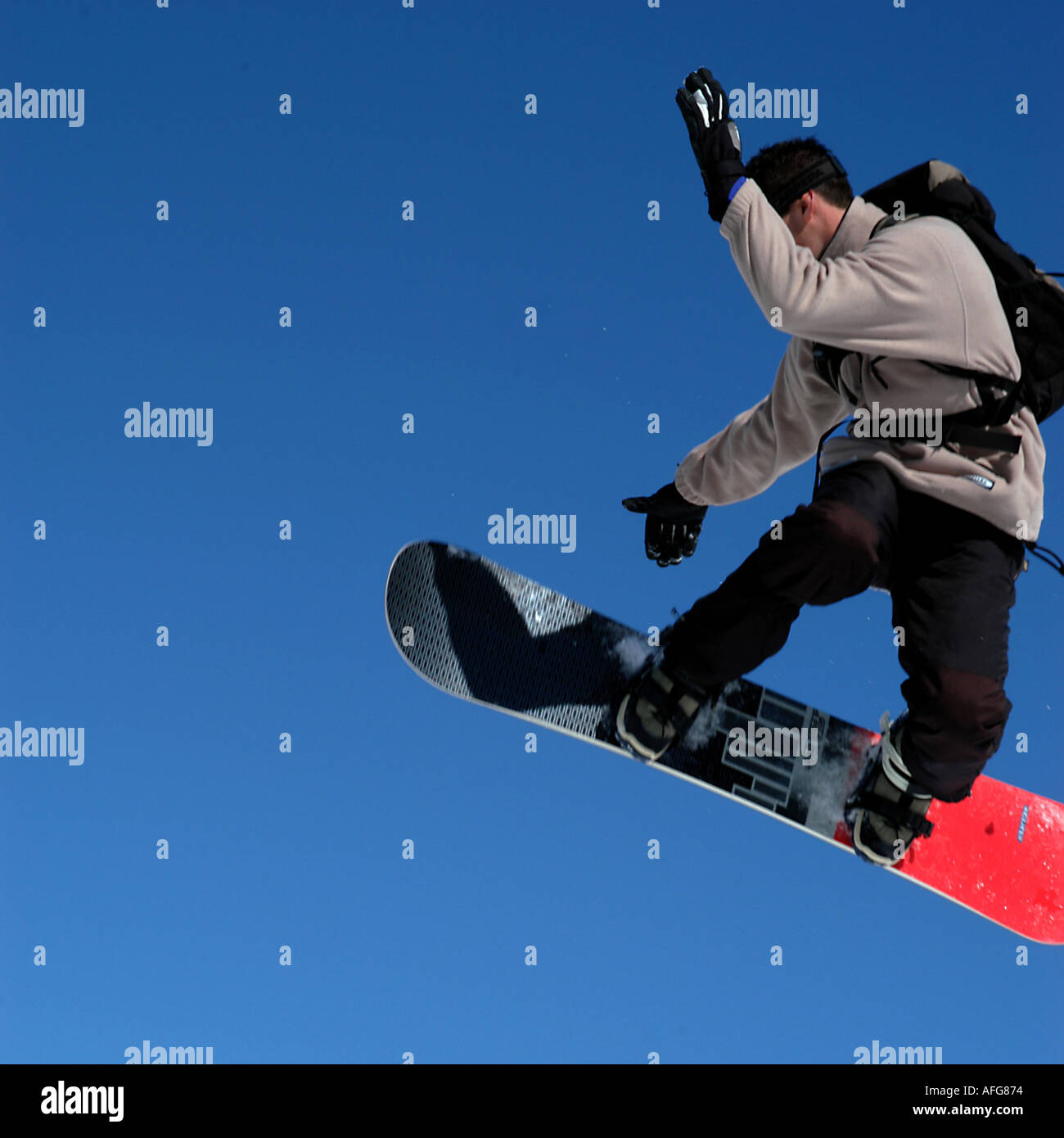 Snowboarder jumping Stock Photo