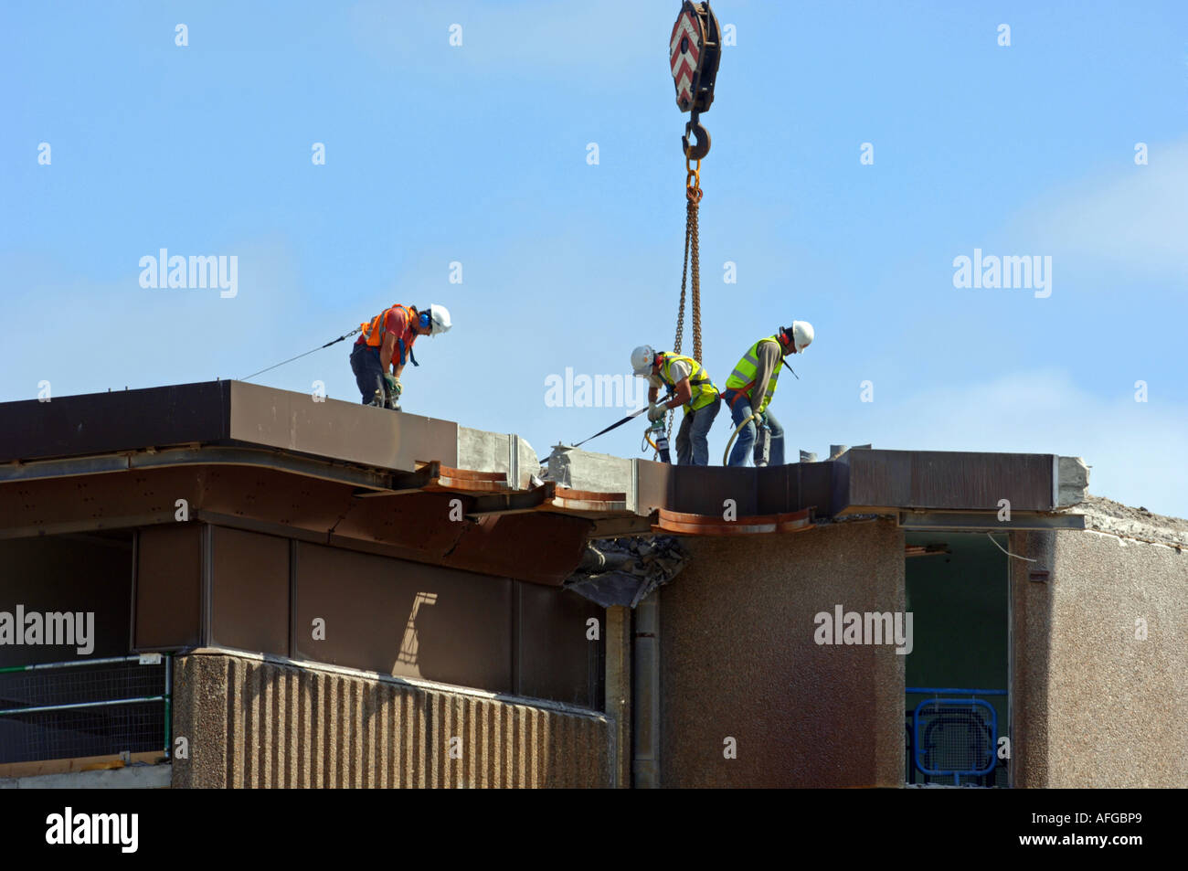 Construction workers use pneumatic drill to demolish a building, Britain UK Stock Photo