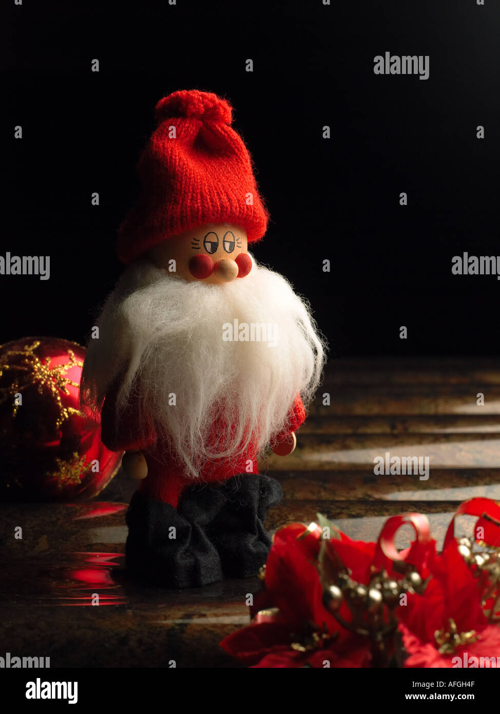wooden Santa on dark background Stock Photo