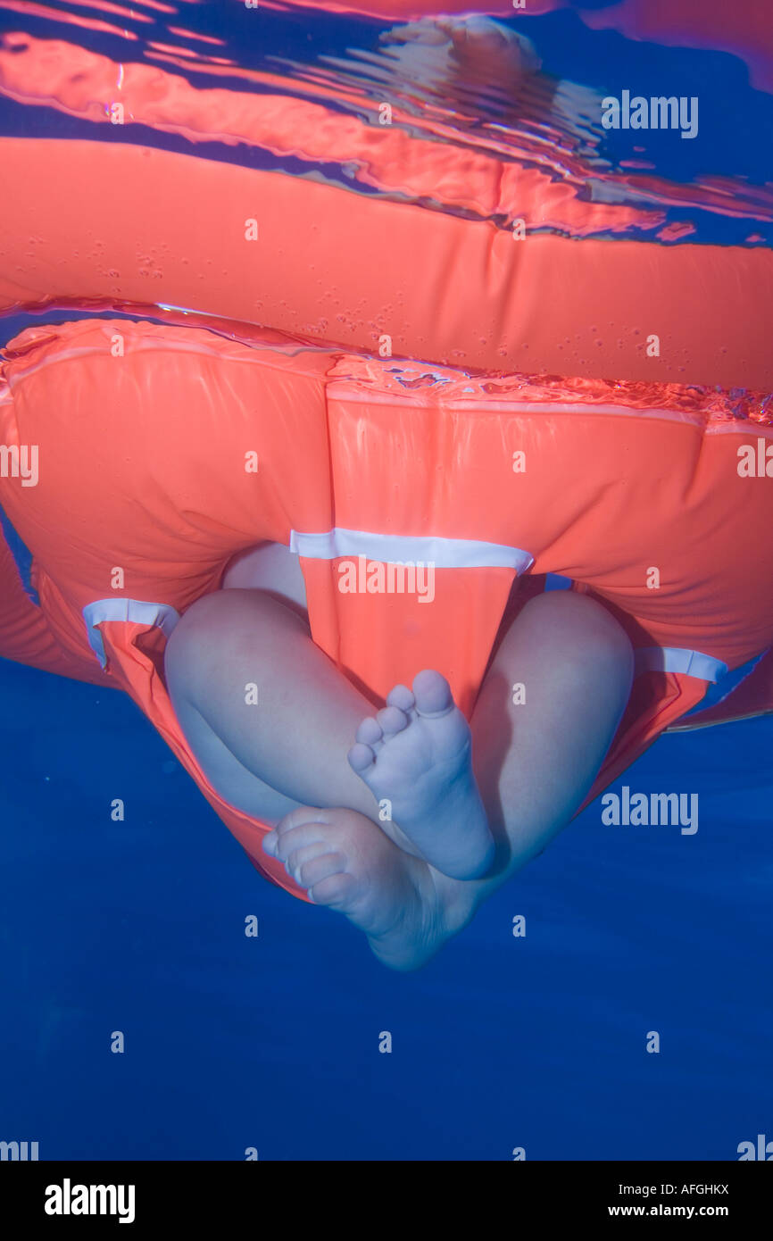 Baby feet under water Stock Photo Alamy