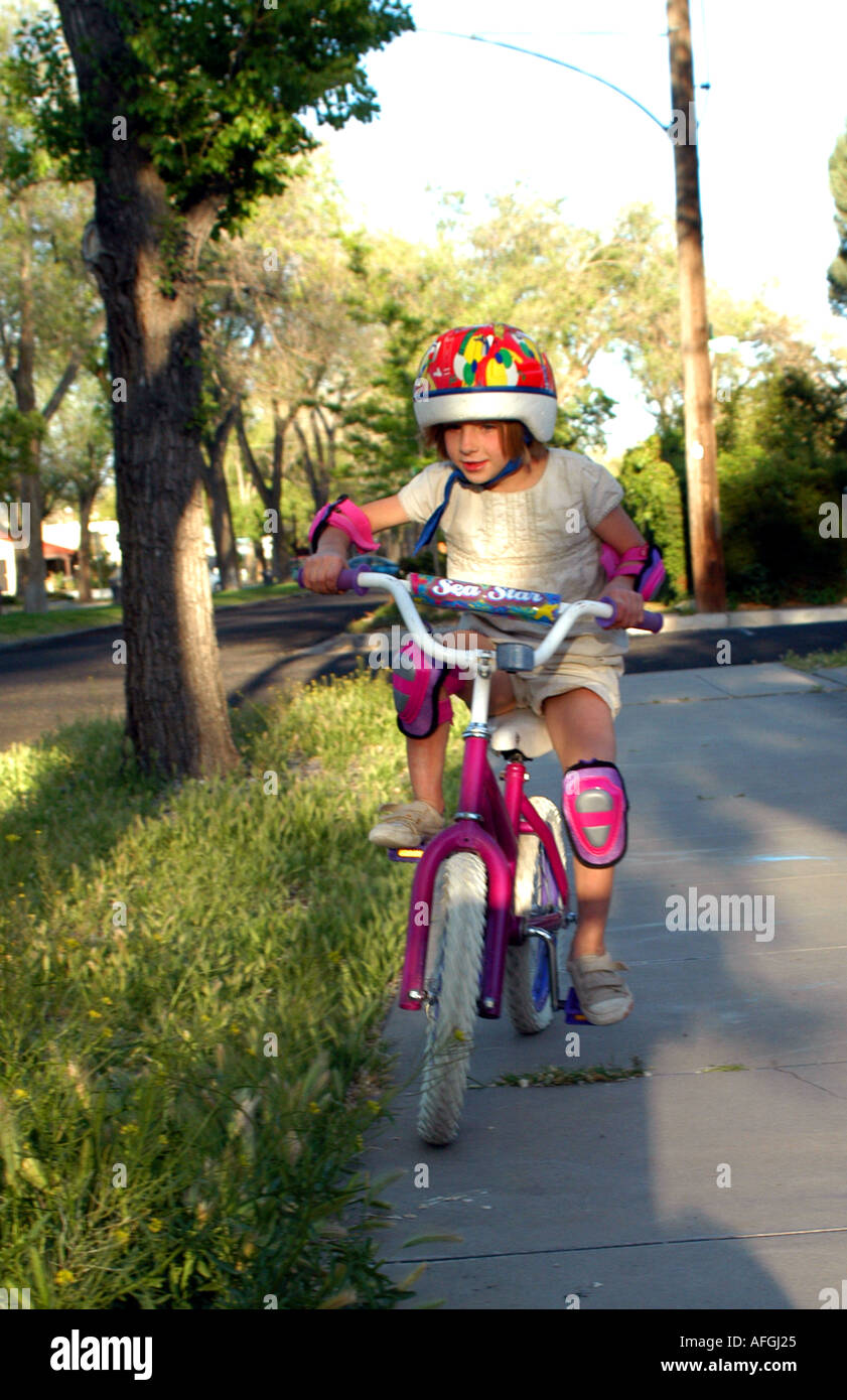 girl learning to ride a bike Stock Photo - Alamy