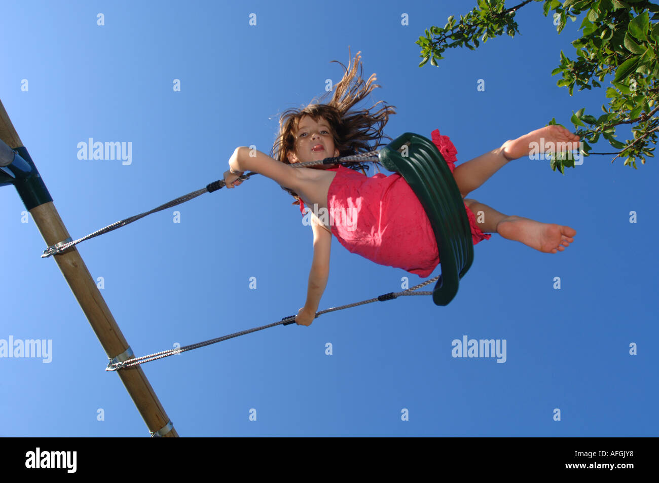 Swing, Girl on a swing Stock Photo Alamy