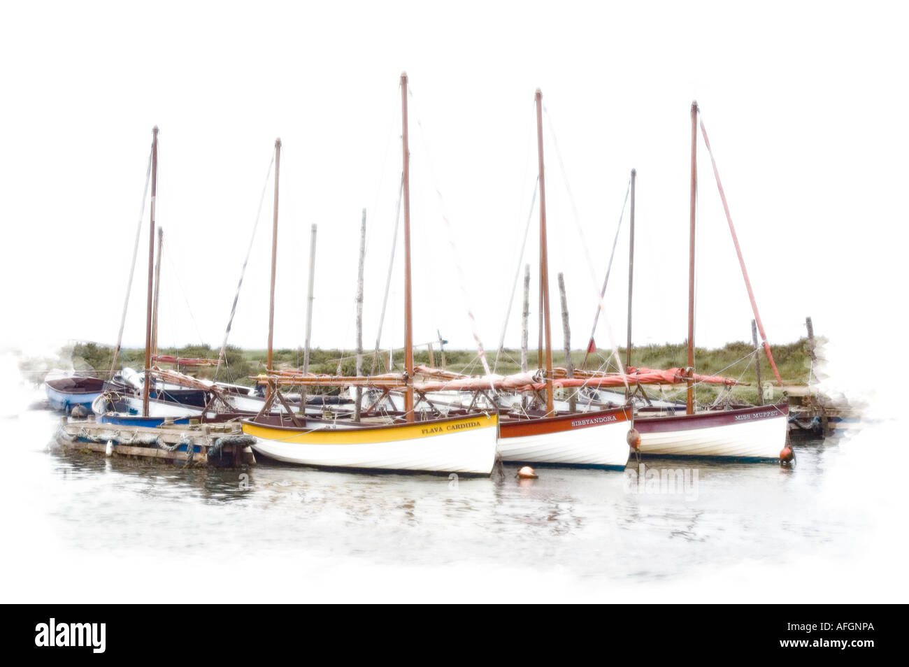 Boats in Blakeney Harbour on Norfolks East Coast with diffuse glow added for artistic effect Stock Photo