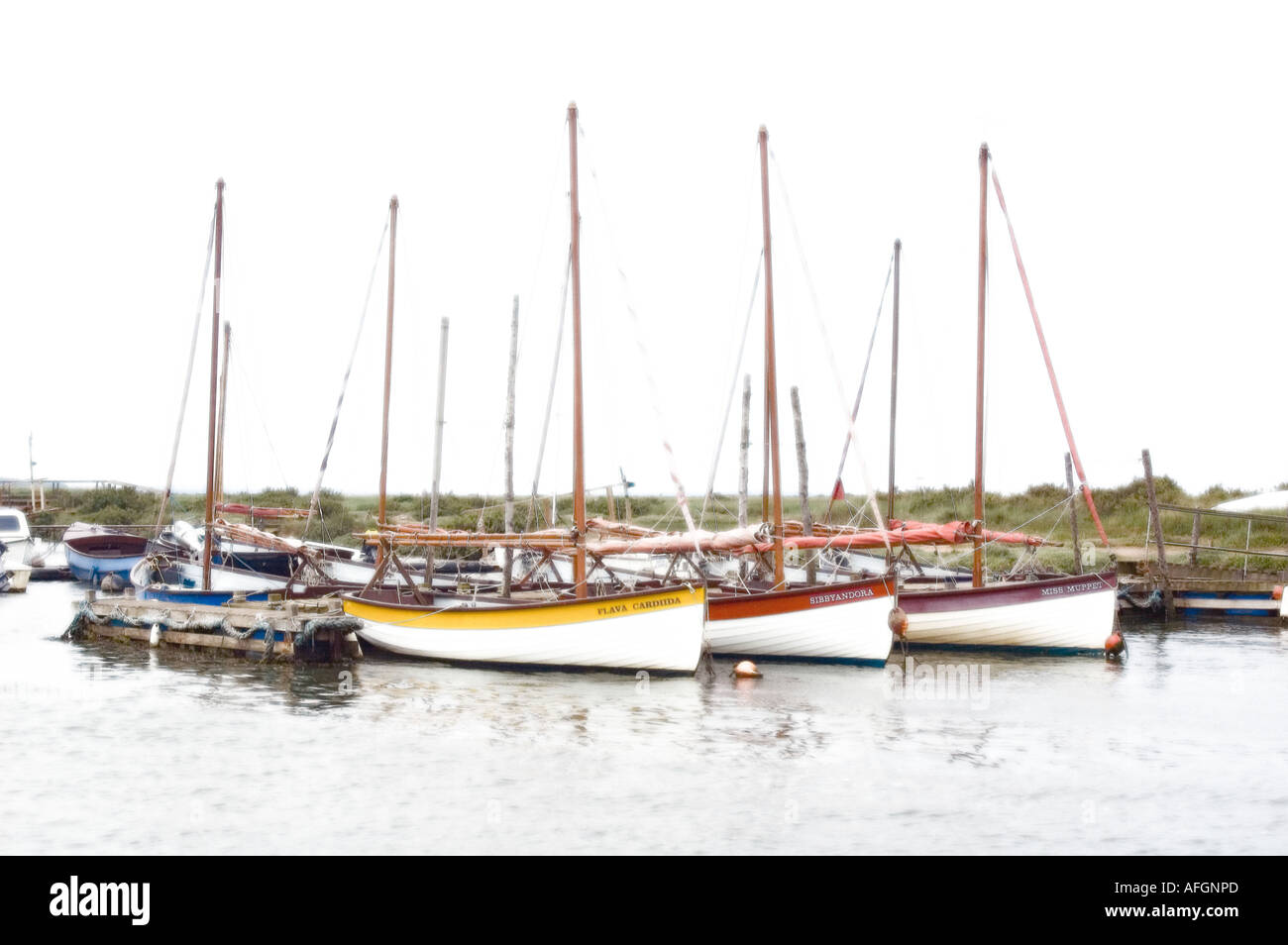 Boats in Blakeney Harbour on Norfolks East Coast with diffuse glow added for artistic effect Stock Photo