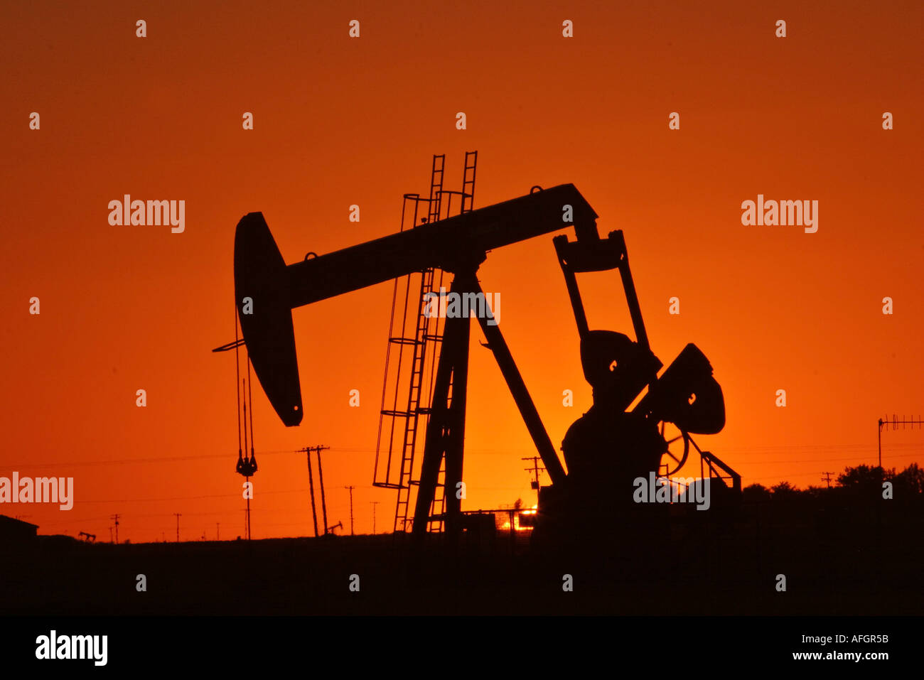 A sunset photos of a pump jack on the Weyburn Oilfields in scenic