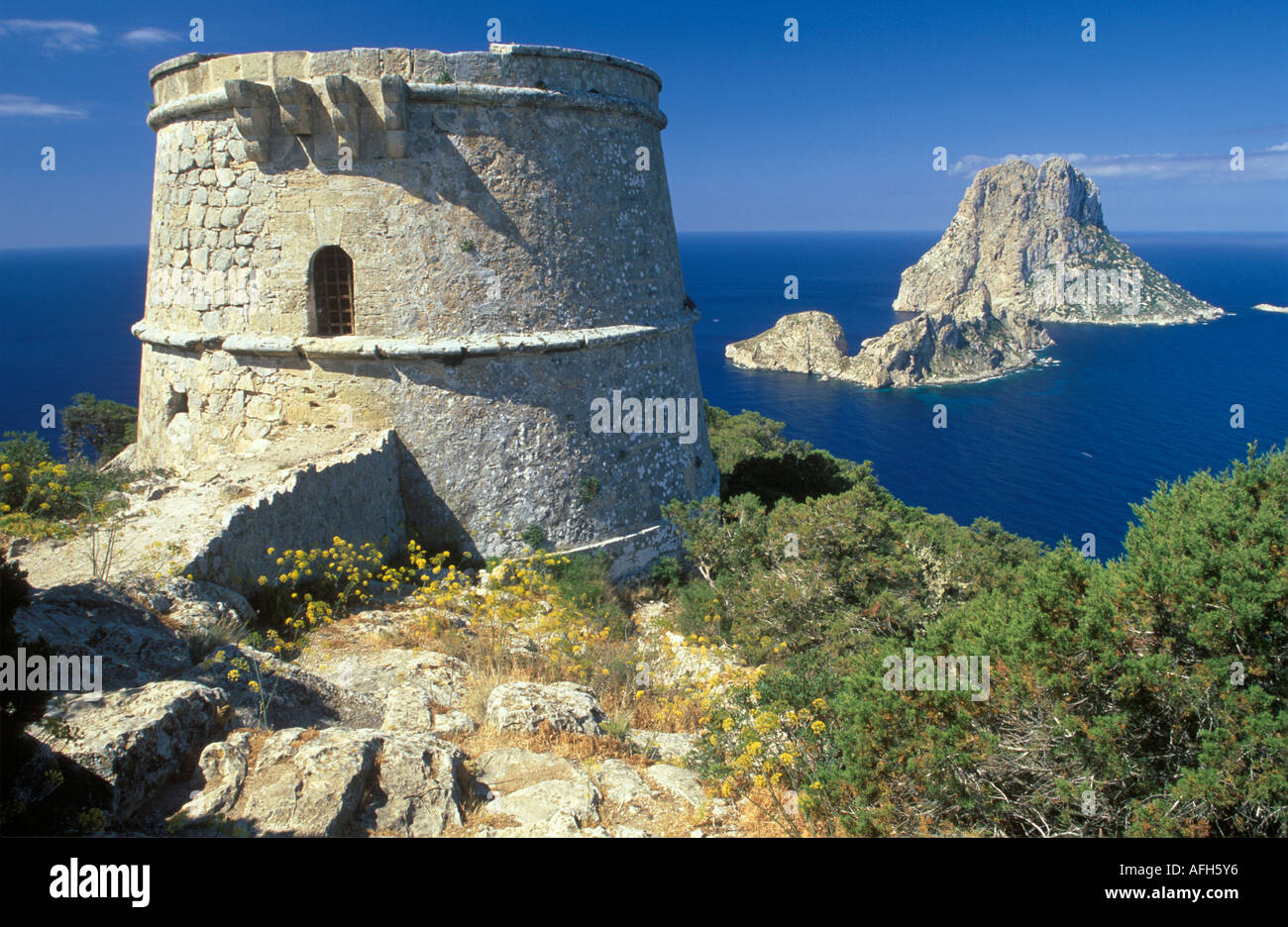 Ibiza, southwest coast, watchtower Torre des Savinar and Es Vedra island Stock Photo