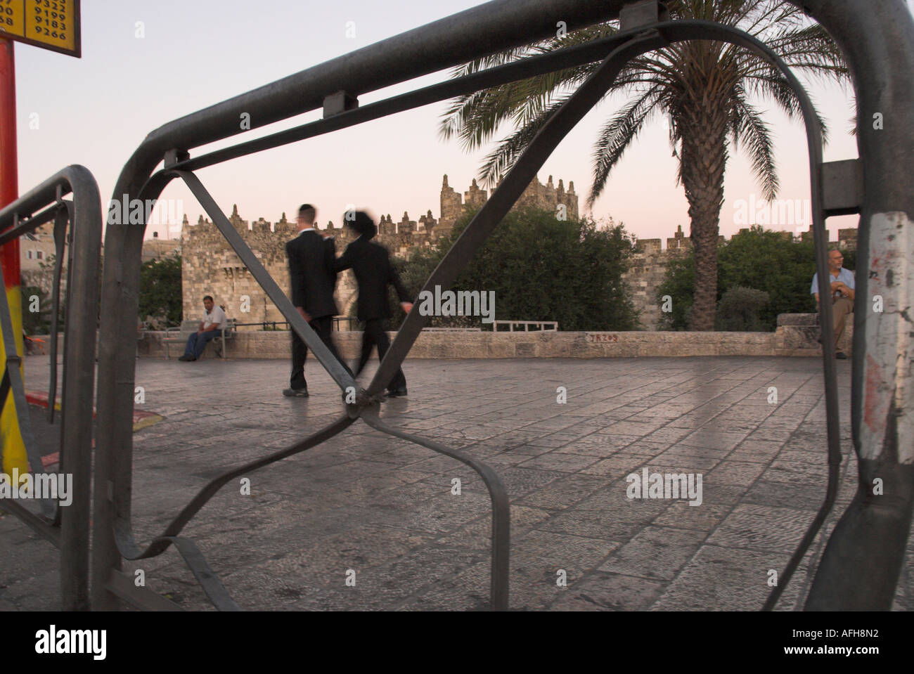 israel Jerusalem Old City Damascus gate 2 orthodox jews walking by with