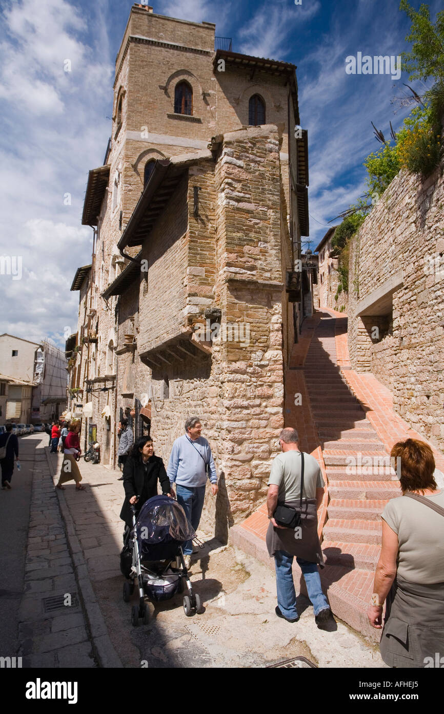 Assissi town streets in summer with blue sky sun sunshine sunny white clouds Asissi Assisi Umbria Italy Italia Europe EU Stock Photo