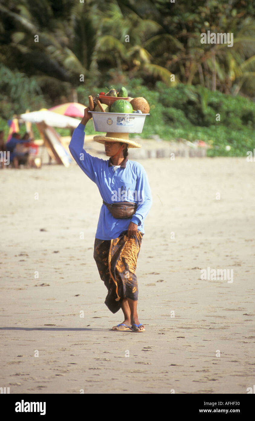 Bali Woman Selling Coconut and Fruit On Beach Kuta Indonesia Stock