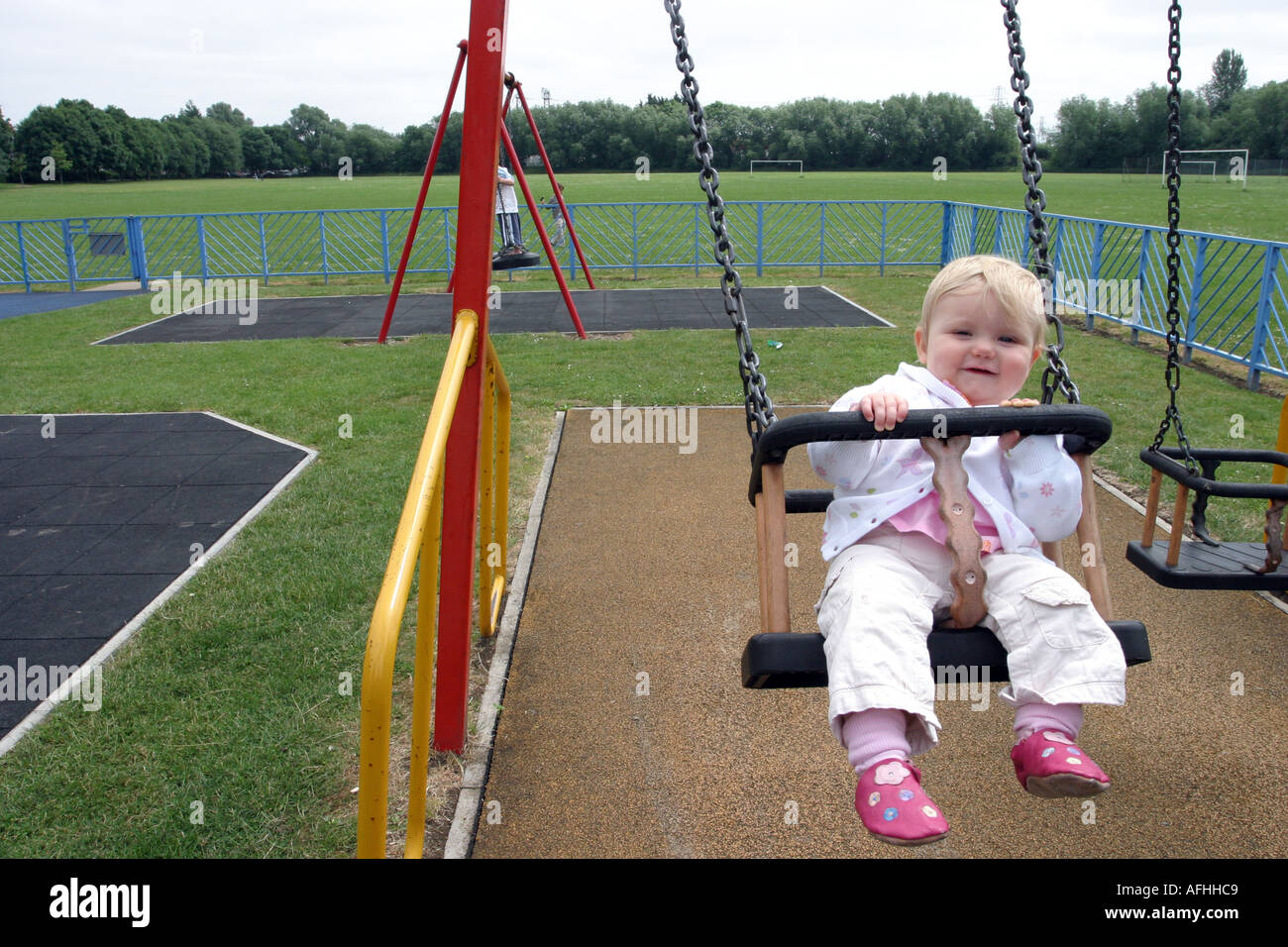 Baby on a swing Stock Photo